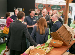 man speaking to group keoghs crisps