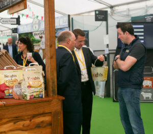 men speaking stand tom keogh