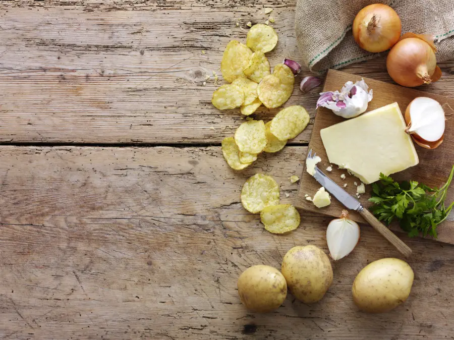 cheese onions and potatoes with board