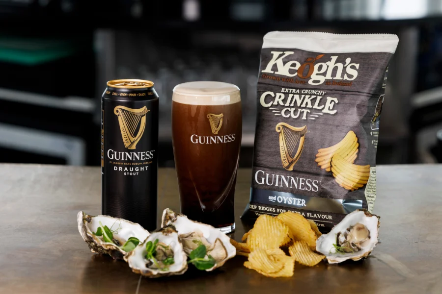 pint of guinness oysters crisps bar top
