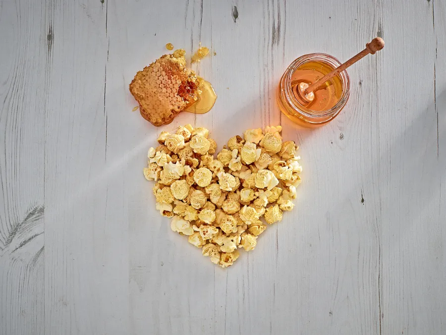 popcorn in heart shape with honey and honeycomb