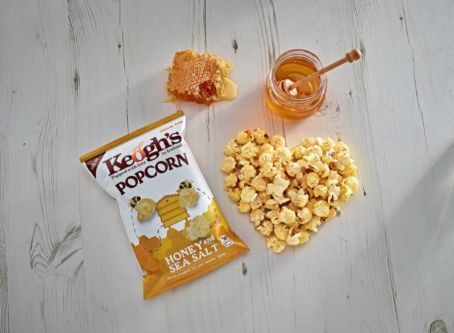 popcorn packet honey honeycomb wooden background