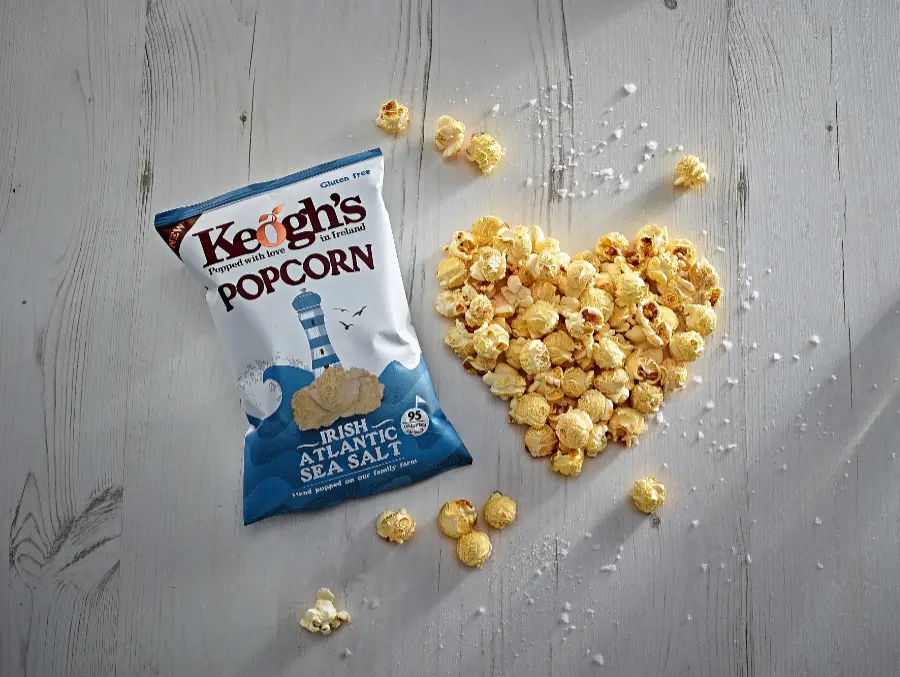 popcorn packet salt wooden background