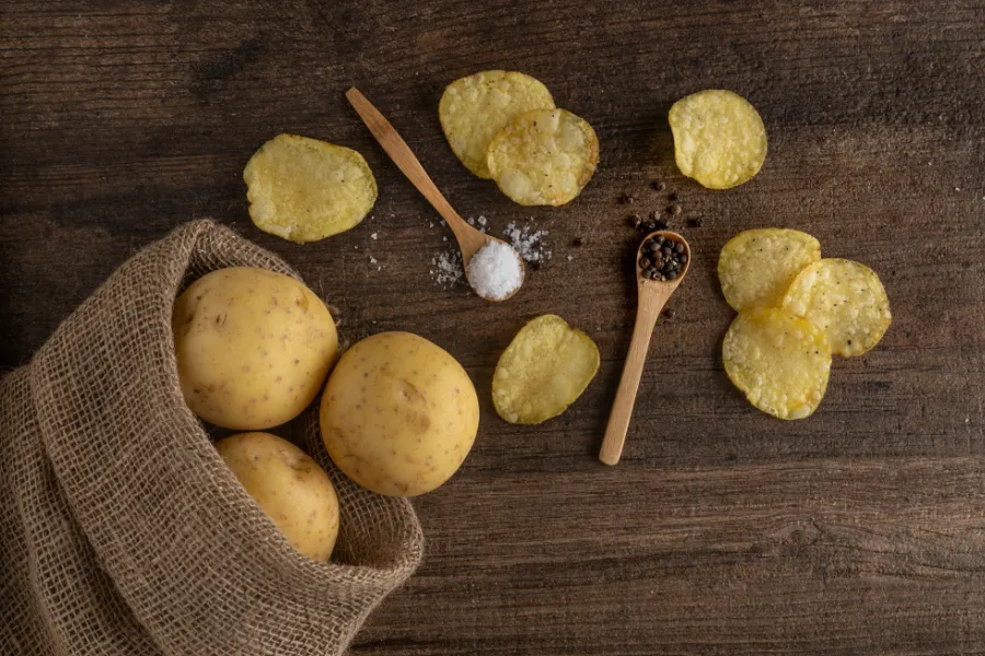 potato sack with wooden spoons salt pepper crisps